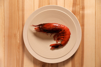 Photo of Fresh carabinero shrimp on wooden table, top view