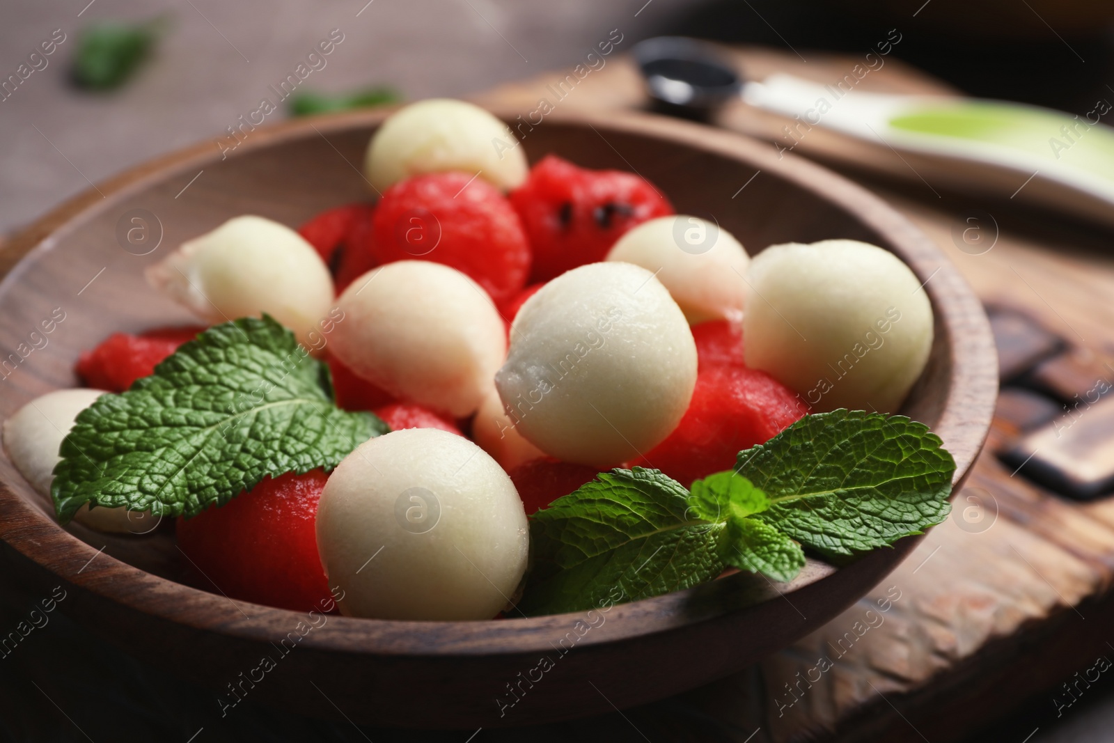 Photo of Plate with melon and watermelon balls on table