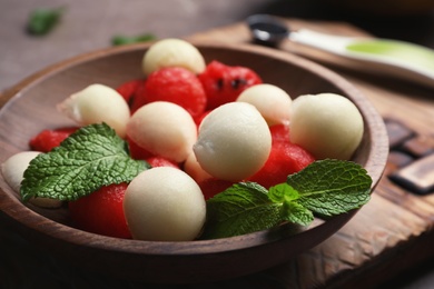 Photo of Plate with melon and watermelon balls on table