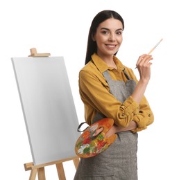 Photo of Young woman with drawing tools near easel on white background
