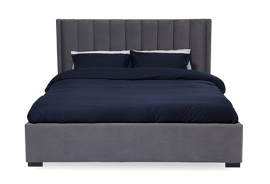 Comfortable gray bed with dark blue linens on white background