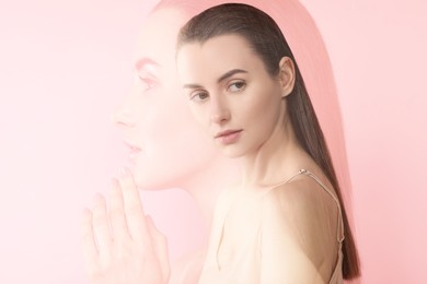 Image of Double exposure of beautiful young woman on pink background