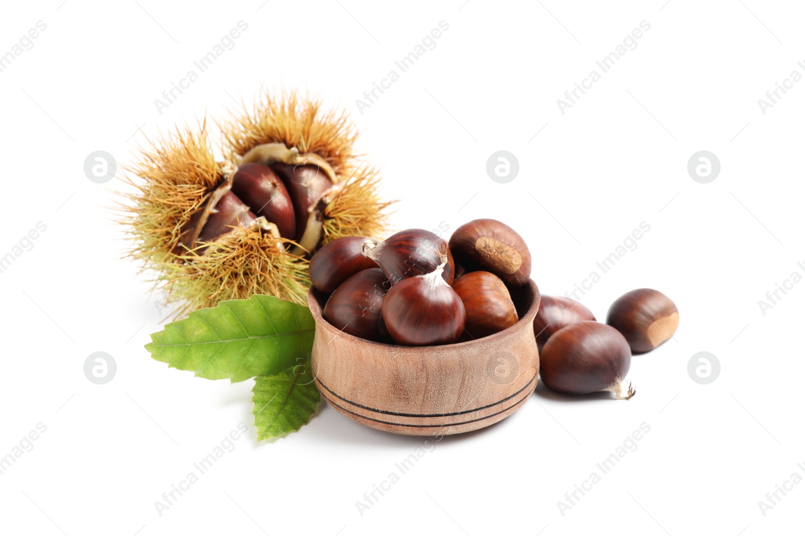 Photo of Fresh sweet edible chestnuts on white background