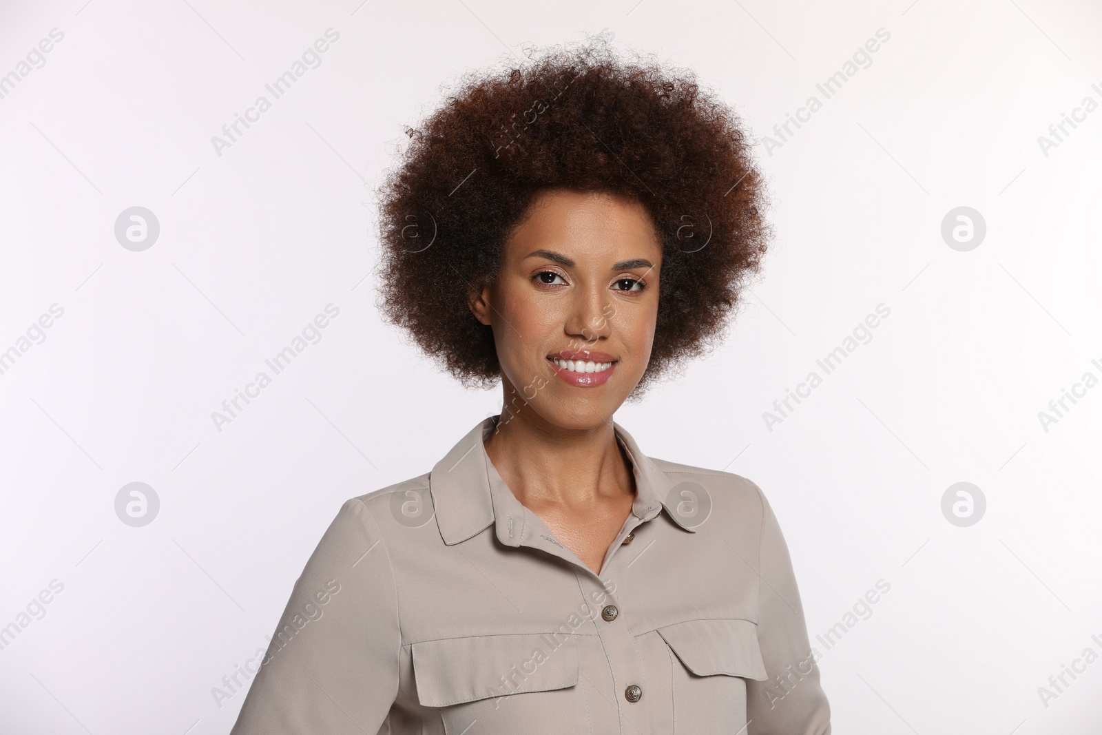 Photo of Portrait of beautiful young woman in stylish blouse on white background