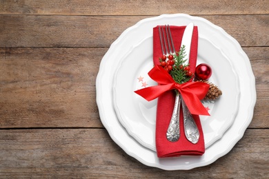 Beautiful Christmas table setting on wooden background, top view