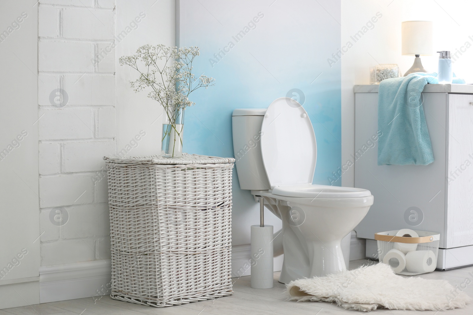 Photo of Modern toilet bowl in stylish bathroom interior