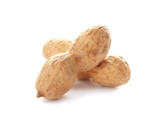 Raw peanuts in pods on white background