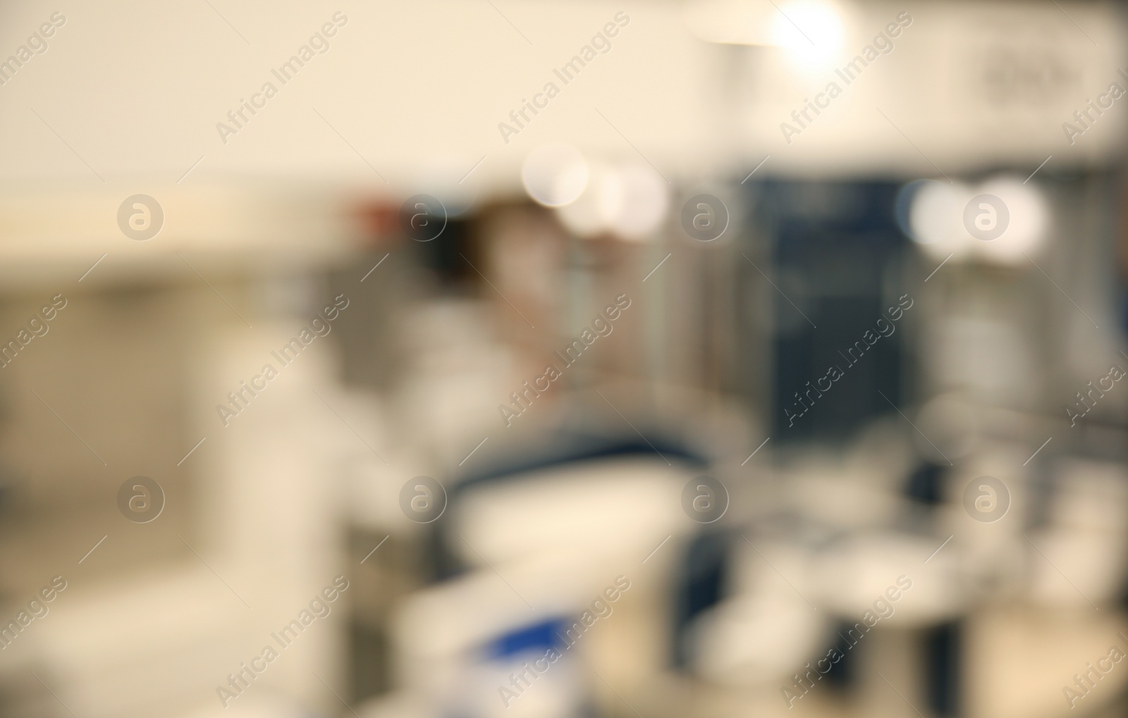 Photo of Blurred view of modern shopping mall interior