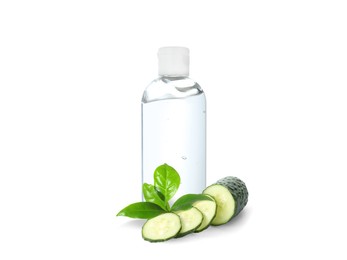 Bottle of micellar cleansing water, fresh cucumber and green leaves on white background. Makeup remover