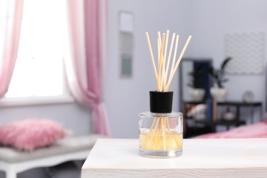 Photo of Reed freshener on table indoors