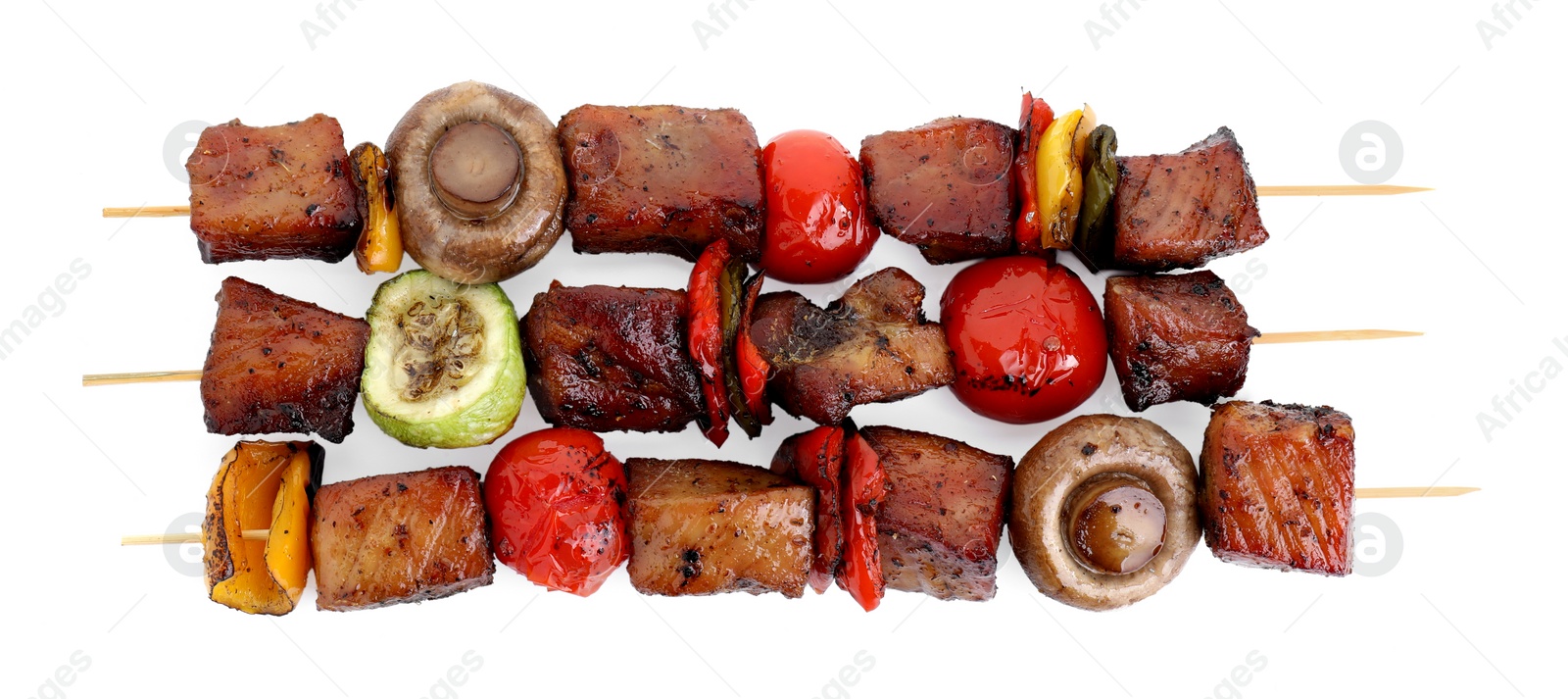 Photo of Delicious shish kebabs with vegetables isolated on white, top view