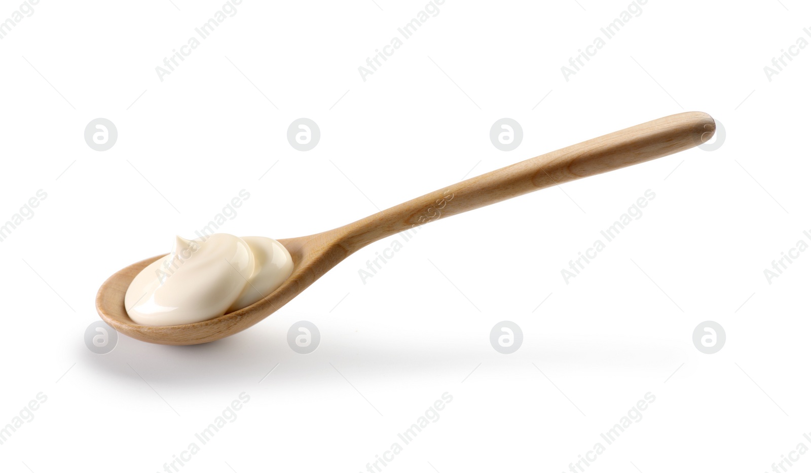 Photo of Natural yogurt in wooden spoon isolated on white