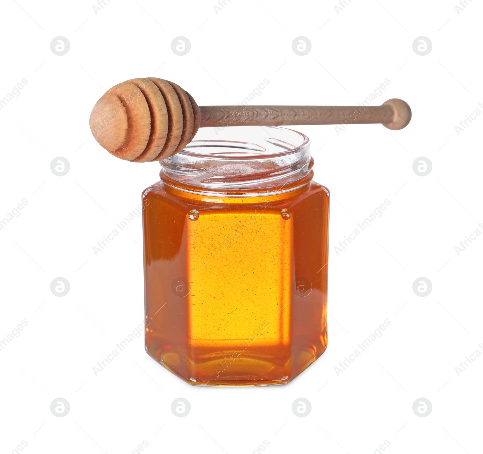 Photo of Tasty natural honey in glass jar and dipper isolated on white