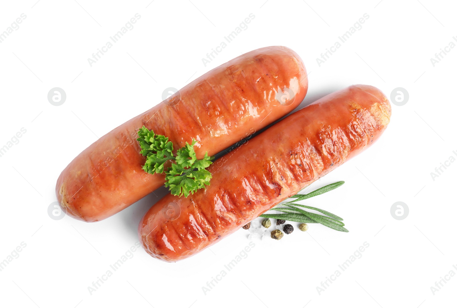 Photo of Delicious grilled sausages on white background, top view. Barbecue food