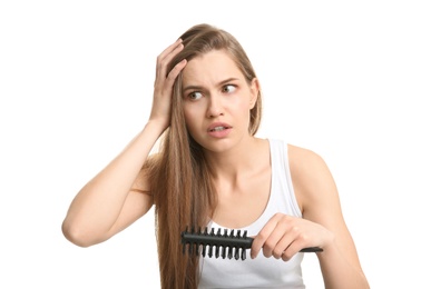 Young woman with hair loss problem on white background