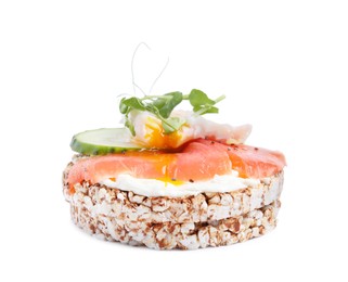 Photo of Crunchy buckwheat cakes with salmon, poached egg and cucumber slices isolated on white
