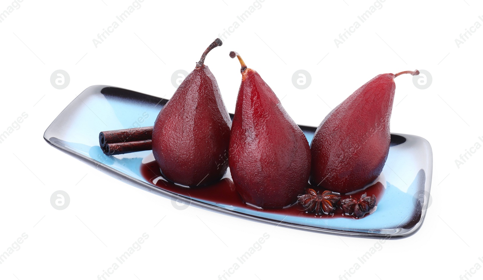 Photo of Tasty red wine poached pears and spices isolated on white