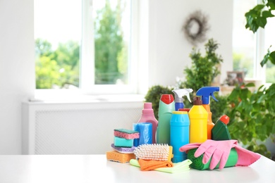 Set of cleaning supplies on table indoors