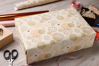 Photo of Beautifully wrapped gift boxes on wooden table