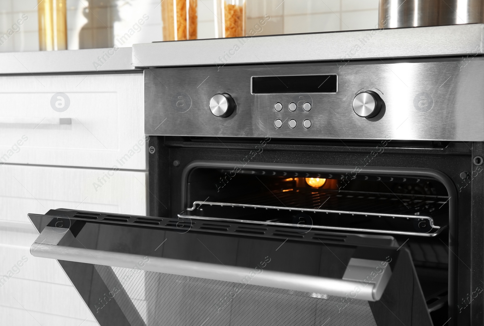 Photo of Open modern oven built in kitchen furniture