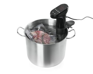 Photo of Thermal immersion circulator and vacuum packed meat in pot on white background. Sous vide cooking