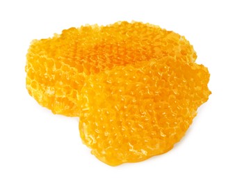 Photo of Pieces of natural honeycomb with tasty honey isolated on white