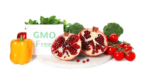 Photo of Tasty fresh GMO free products and paper card on white background