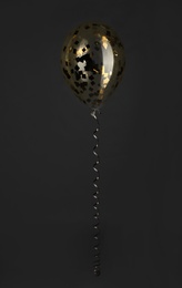 Bright balloon with sparkles on dark background