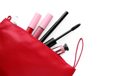 Black eyeliner and other makeup products in cosmetic bag on white background, top view