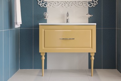 Photo of Bathroom interior with mirror and vanity unit on display in store