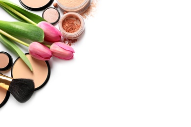 Photo of Many different makeup products and spring flowers on white background, top view