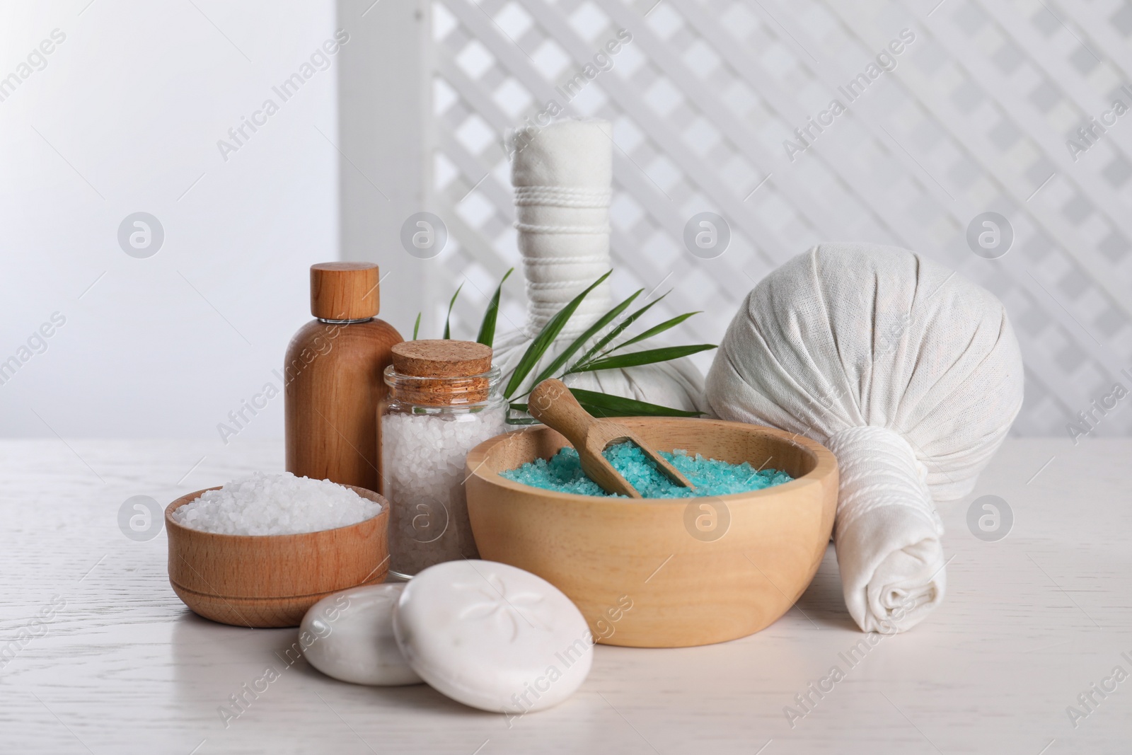 Photo of Spa composition with care products on white wooden table