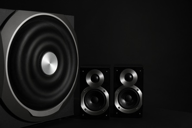 Modern powerful audio speaker system on black background