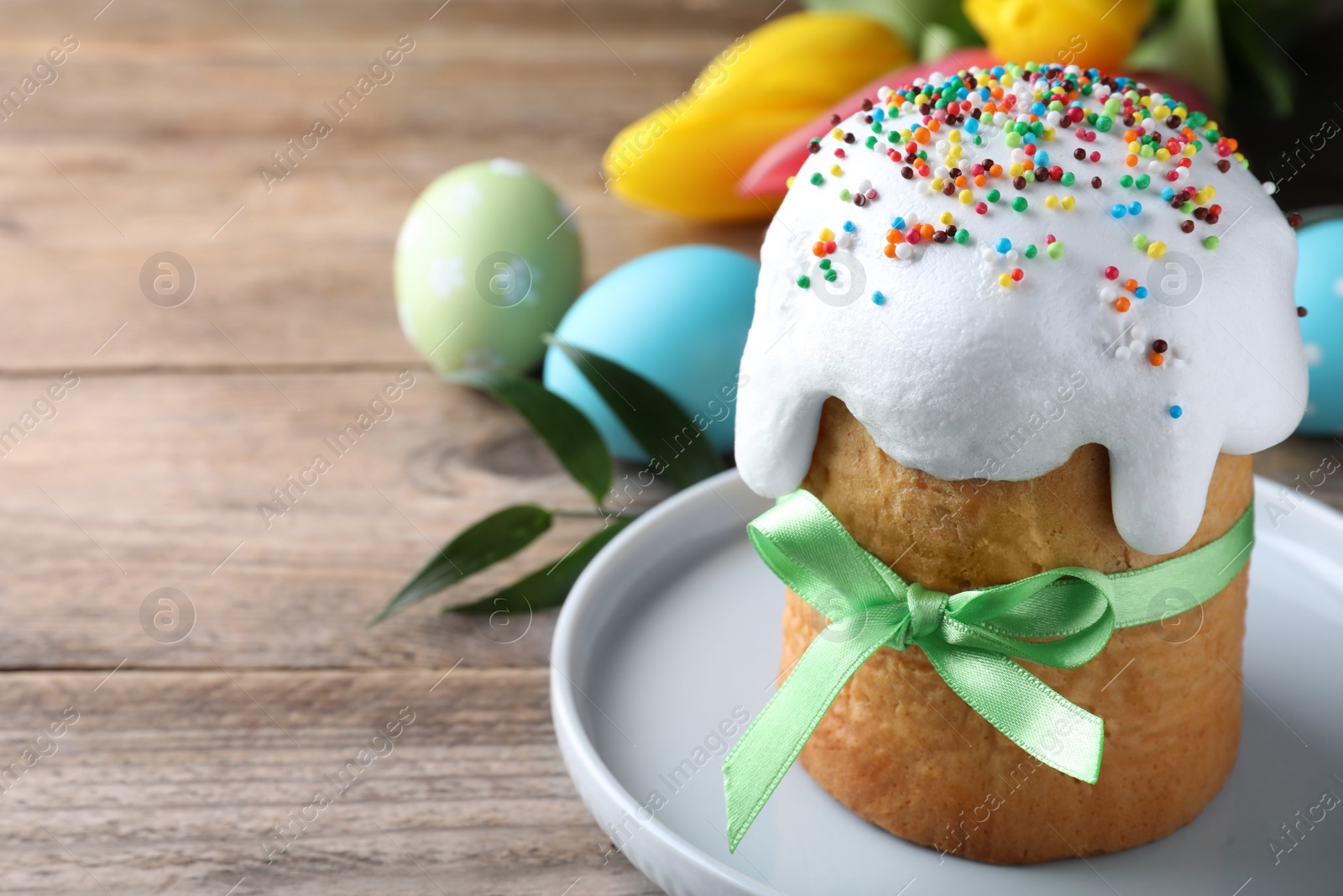 Photo of Beautiful Easter cake on wooden table. Space for text