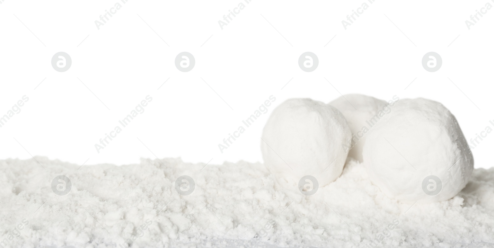 Photo of Round snowballs against white background. Space for text