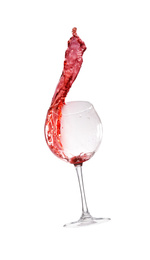 Photo of Red wine splashing out of glass on white background