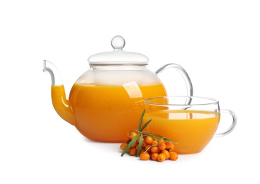 Sea buckthorn tea and fresh berries isolated on white