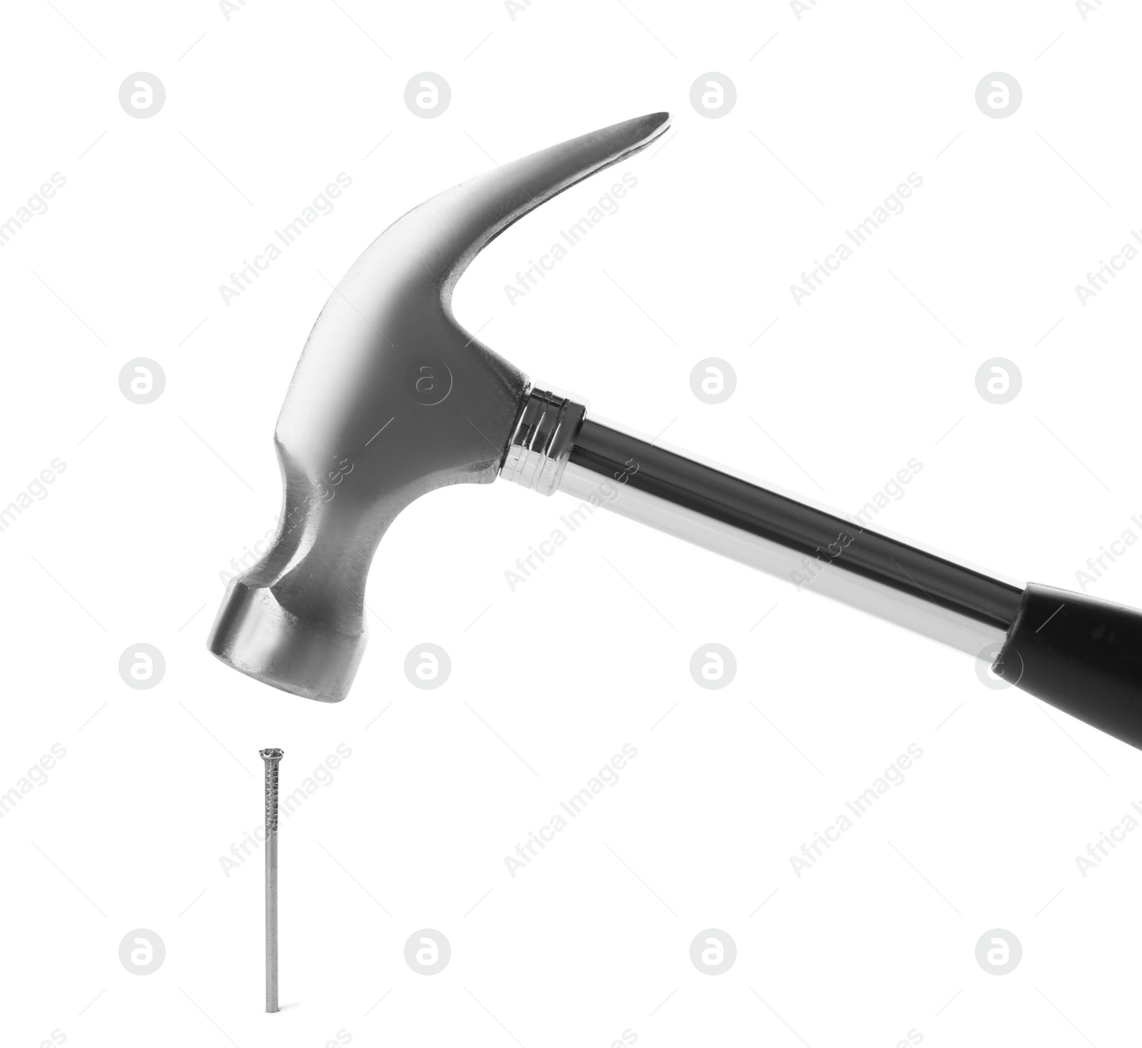 Photo of Hammer and metal nail on white background