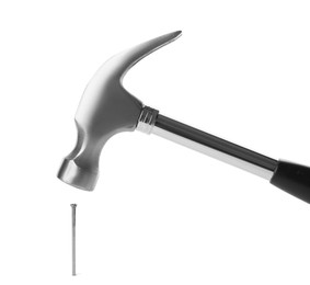 Photo of Hammer and metal nail on white background