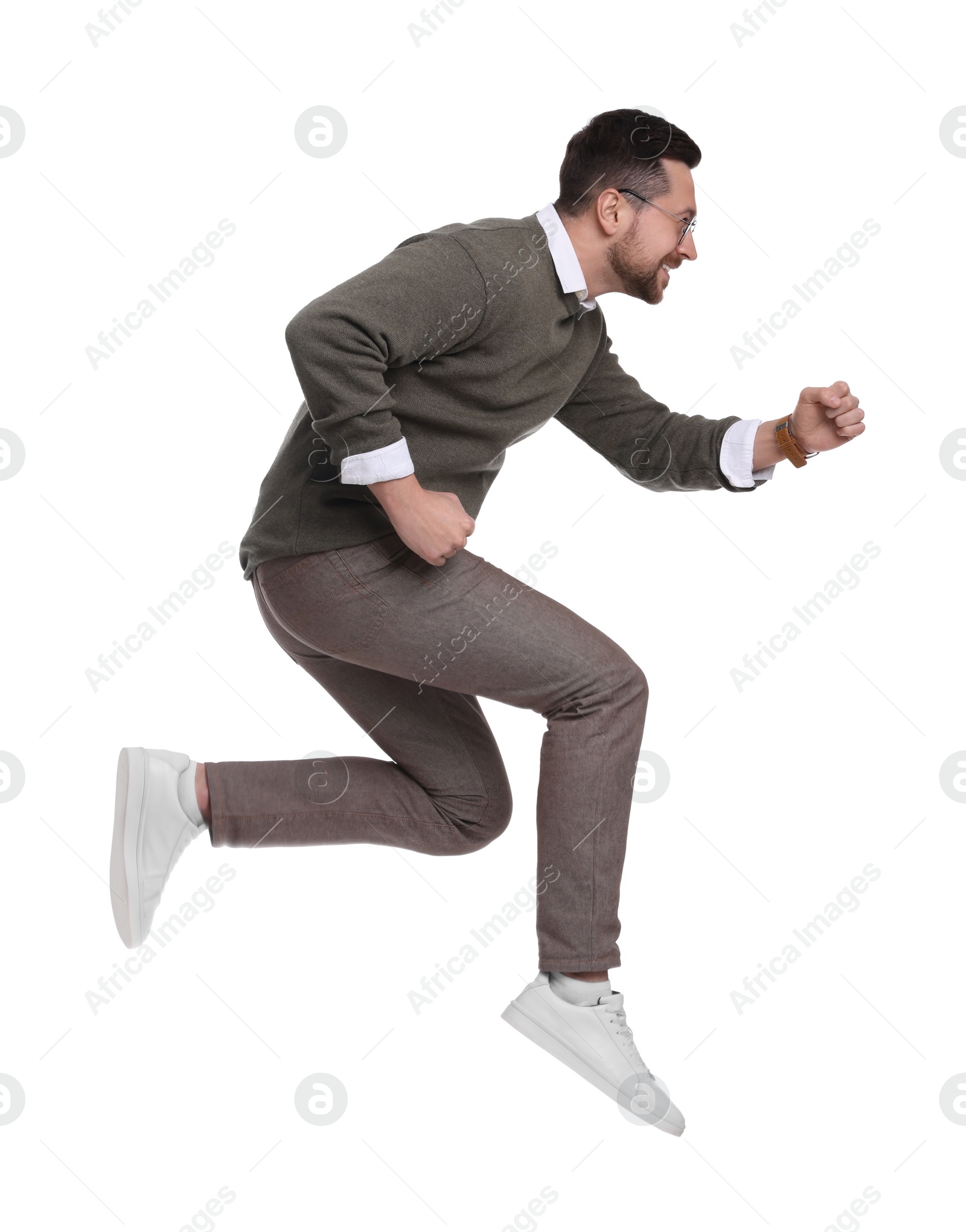 Photo of Handsome bearded businessman jumping on white background