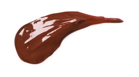 Photo of Smear of tasty melted milk chocolate isolated on white, top view