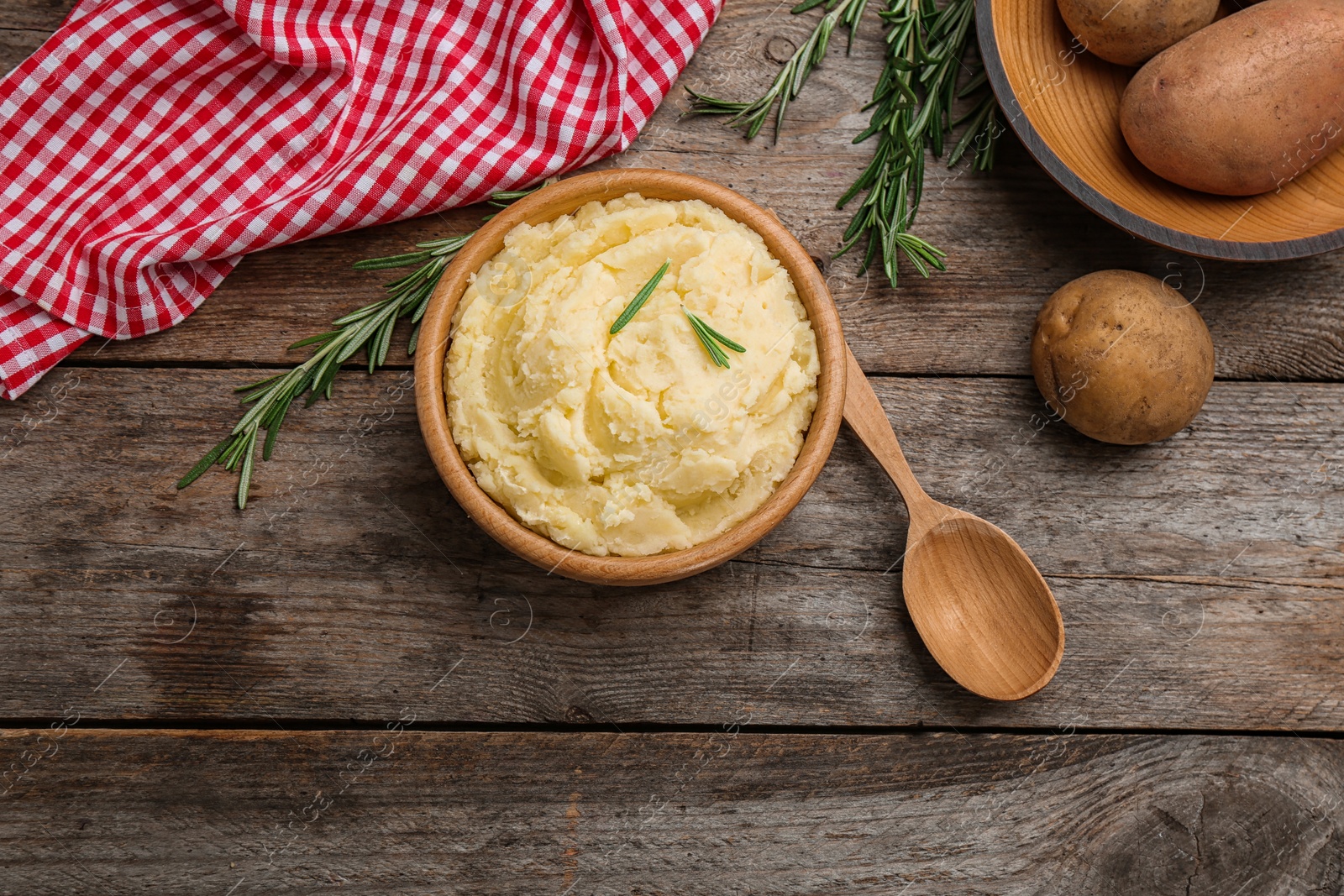 Photo of Flat lay composition with bowl of tasty mashed potato on wooden table