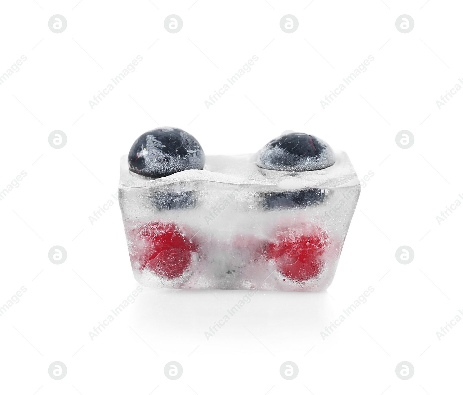 Photo of Raw berries frozen in ice cube on white background