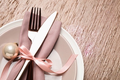 Photo of Beautiful Christmas table setting on brown background, top view