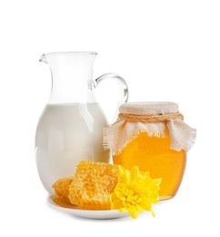 Photo of Beautiful composition with milk and honey on white background