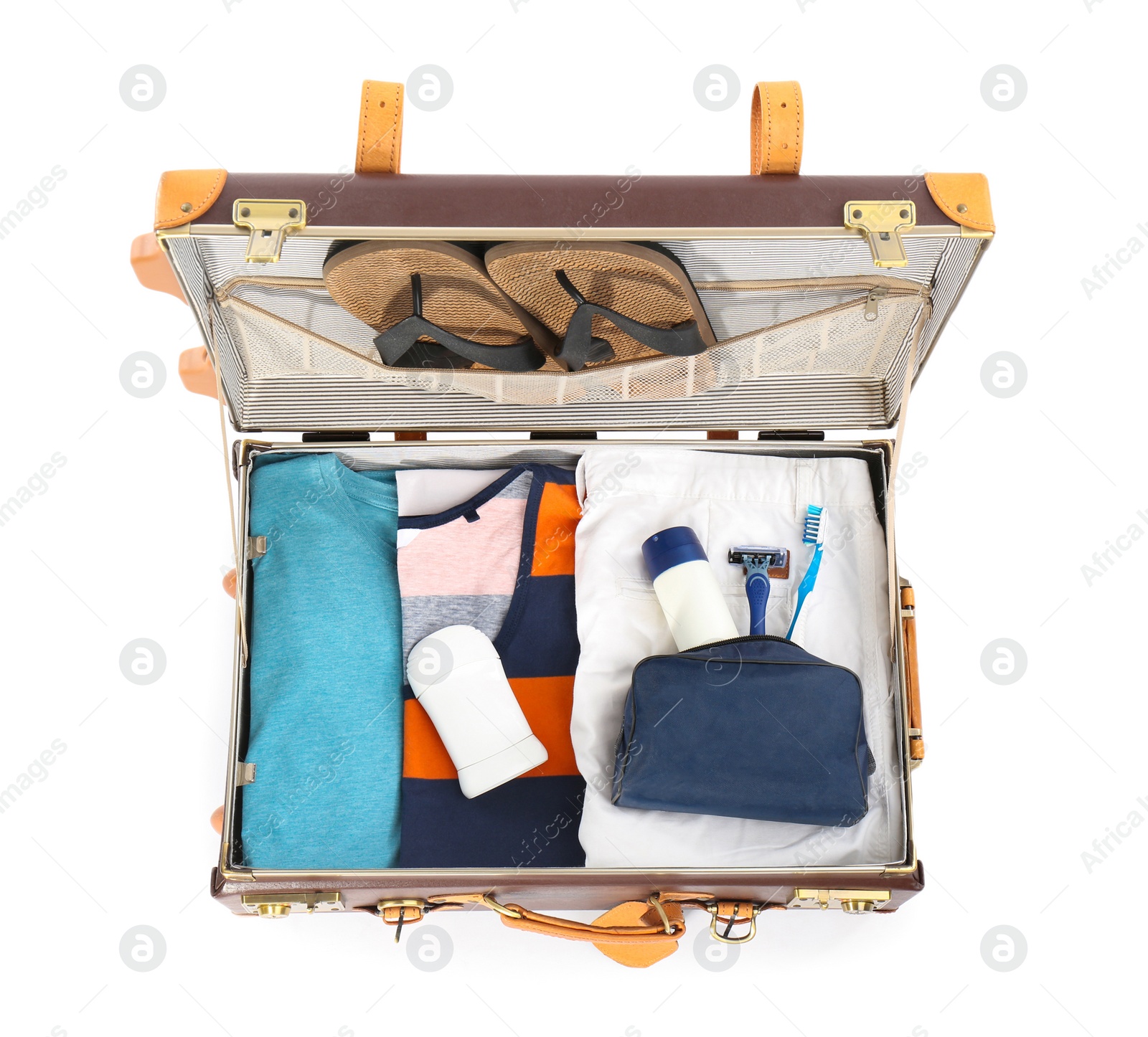 Photo of Packed suitcase with deodorants and clothes on white background, top view