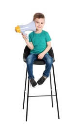Adorable little boy with megaphone on white background