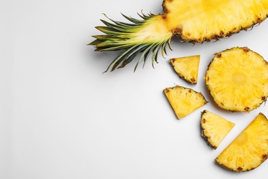 Photo of Composition with raw cut pineapple on white background, top view