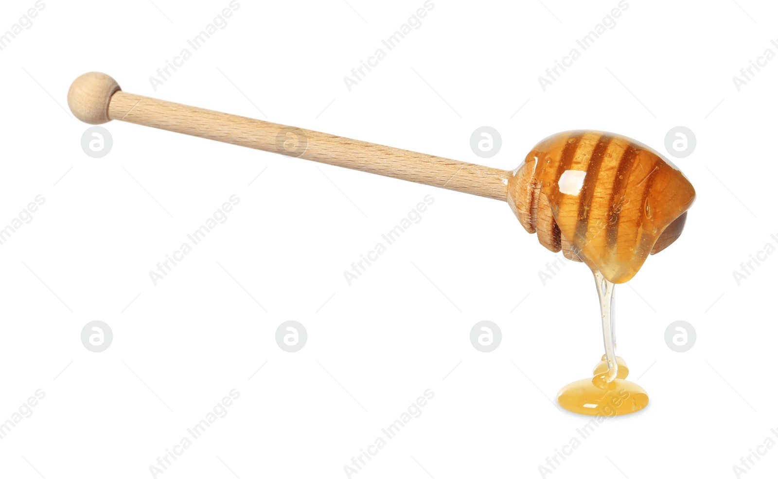 Photo of Natural honey dripping from dipper on white background