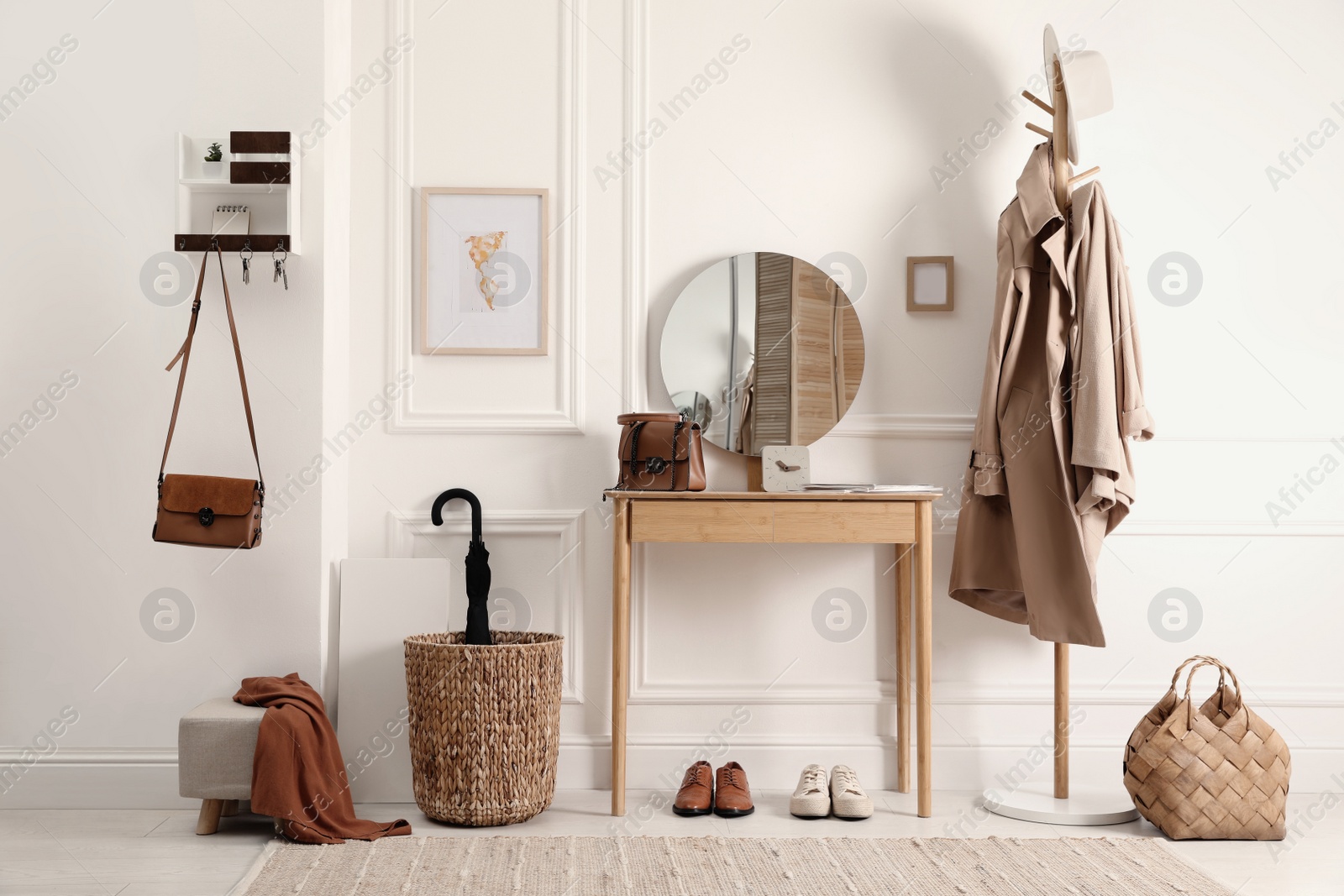 Photo of Modern hallway interior with stylish dressing table and key holder